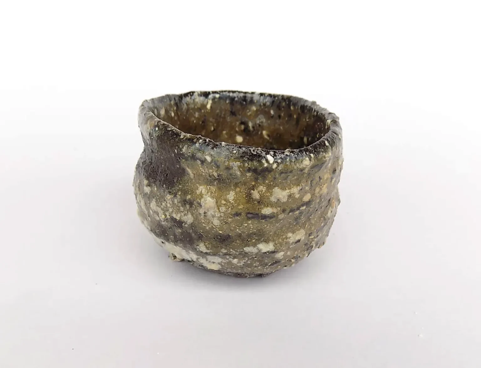 Wood fired Wabi Sabi ochoko side view by Timi Lantos Ceramics