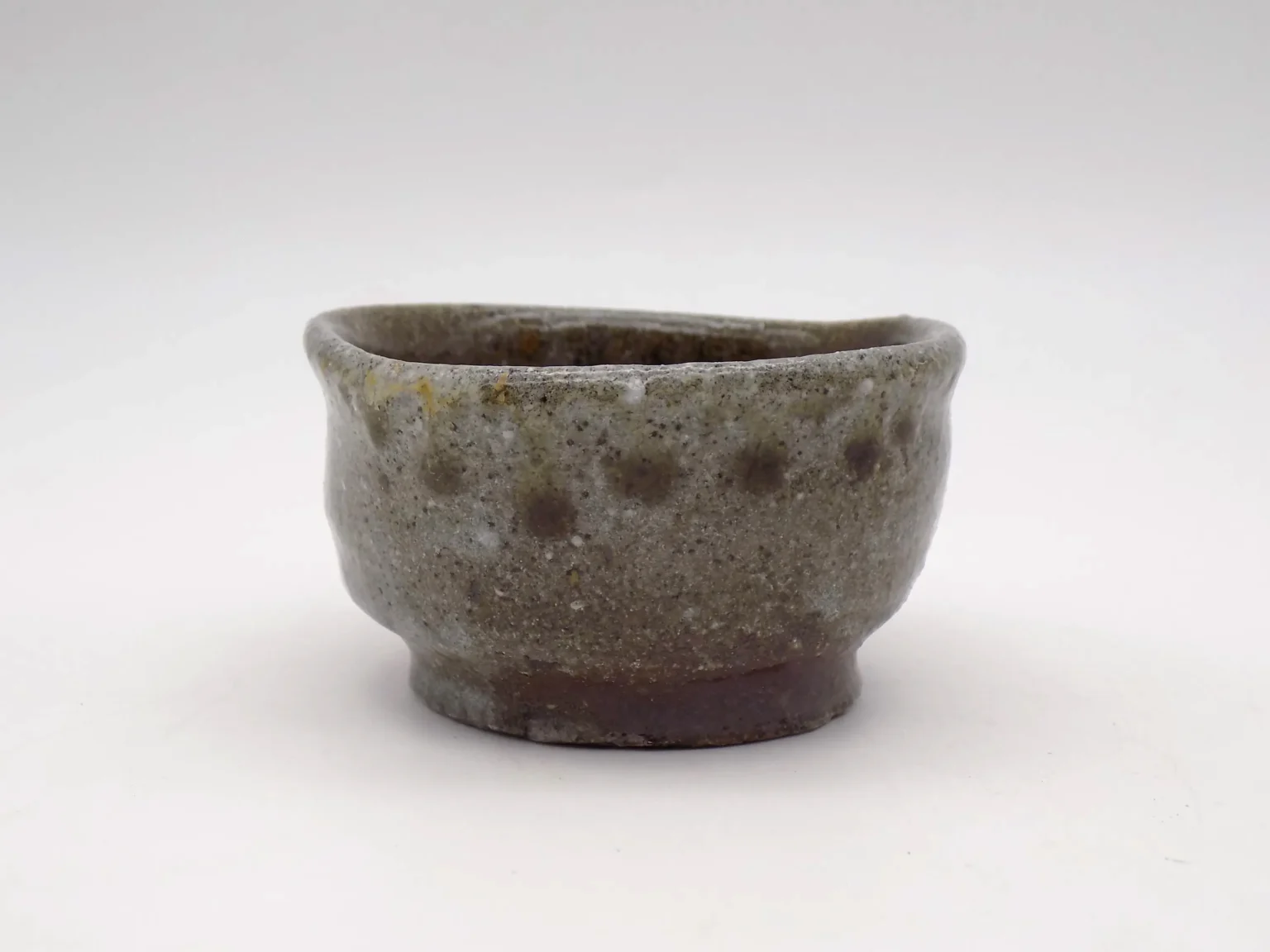 Wood-fired ochoko with wavy ash pattern, top view by Timi Lantos Ceramics