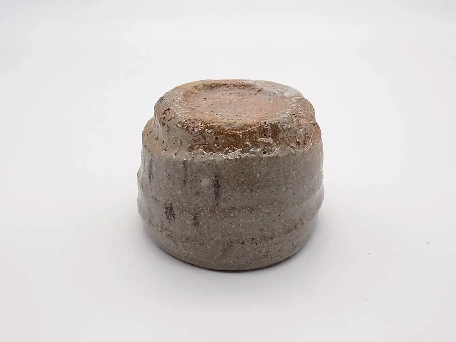 Wood-fired sake cup with ash glaze, bottom view by Timi Lantos Ceramics