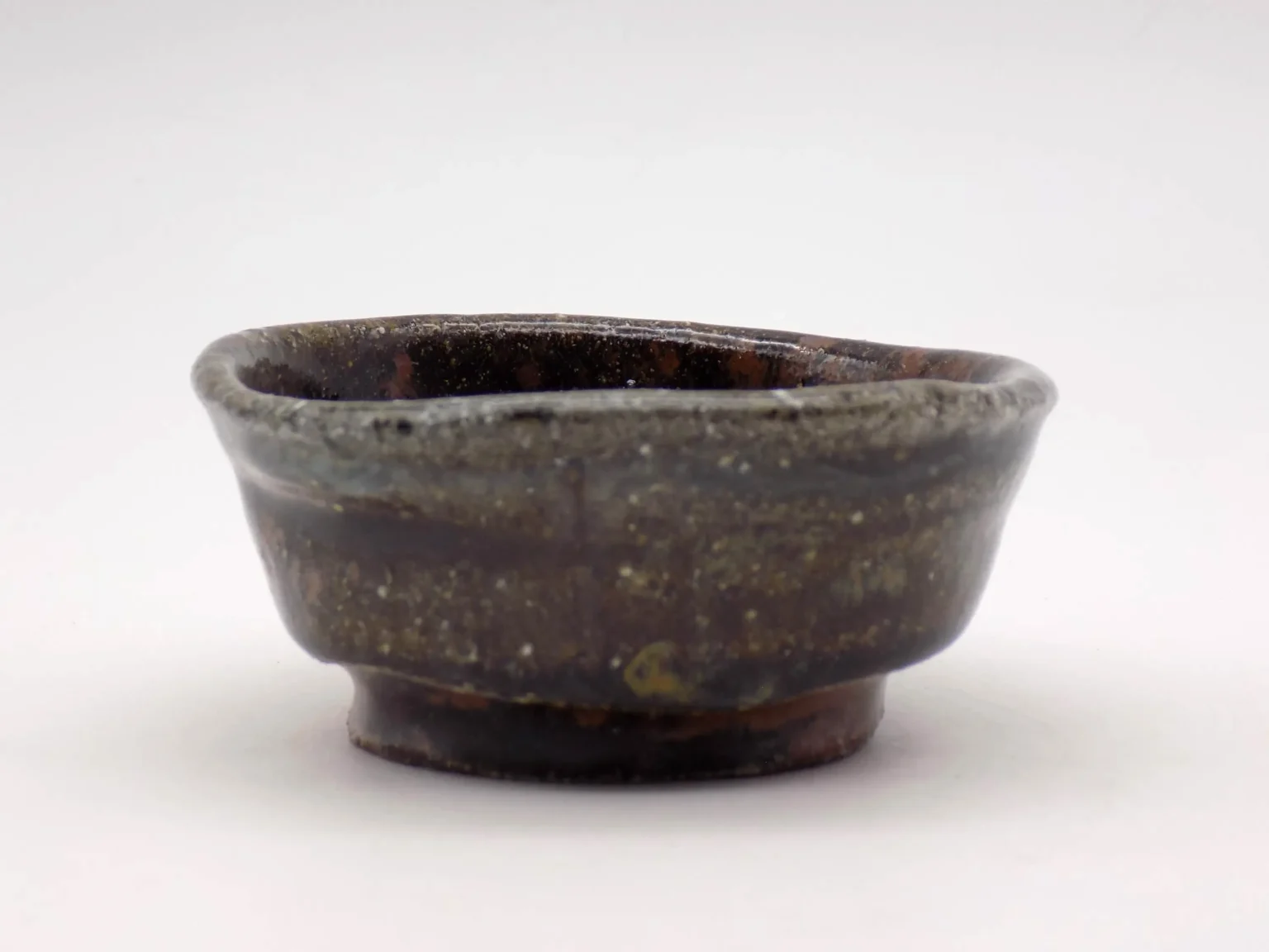Wood-fired sake cup with black glaze by Timi Lantos Ceramics