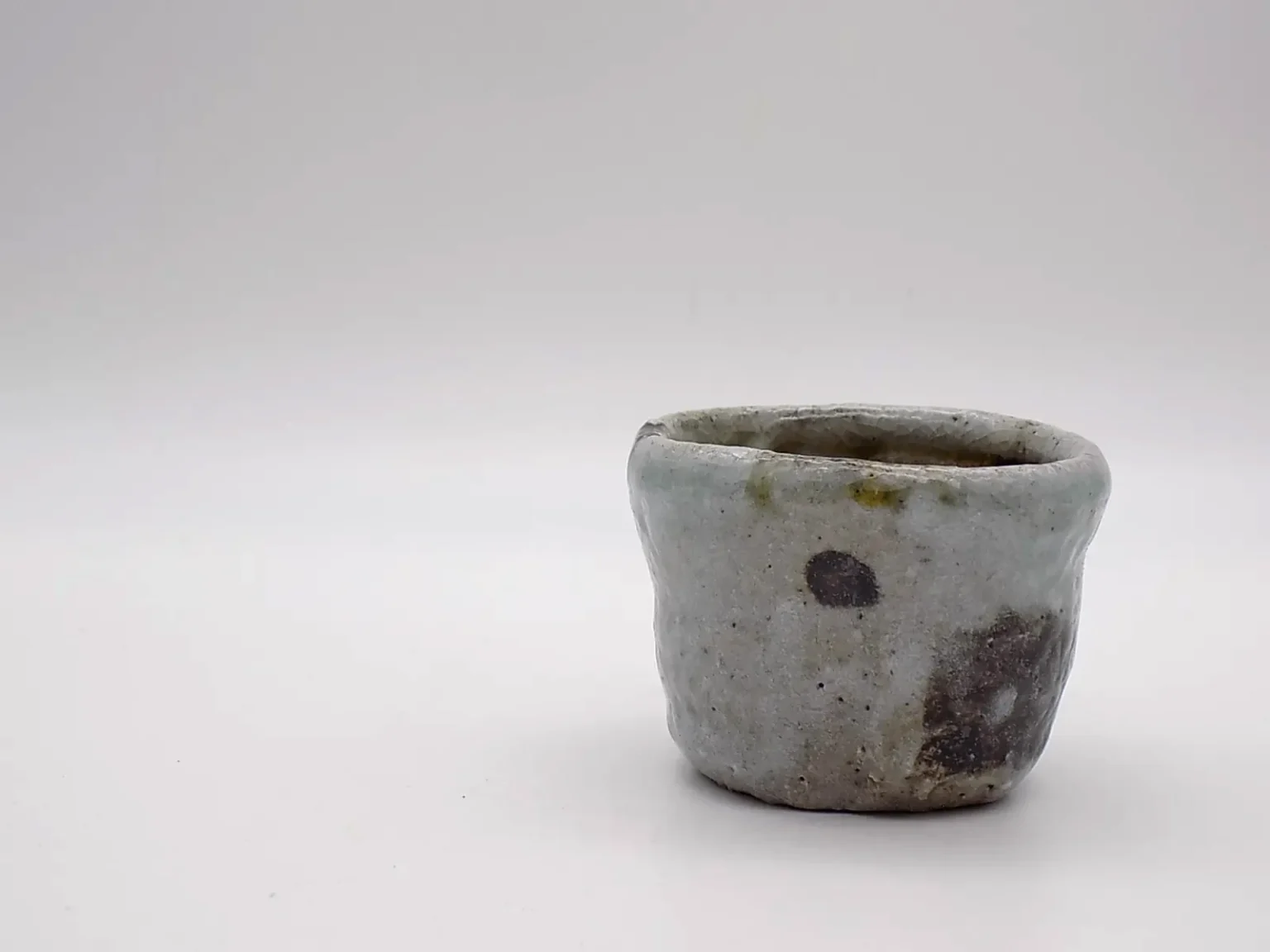 Wood-fired brown sake cup, detail by Timi Lantos Ceramics