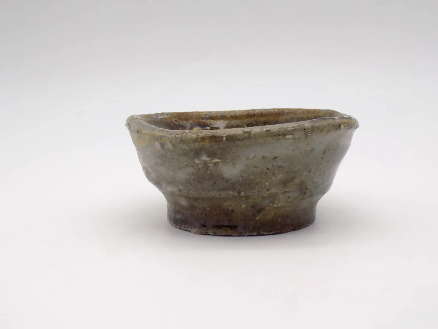 Wood-fired brown sake cup, side view by Timi Lantos Ceramics