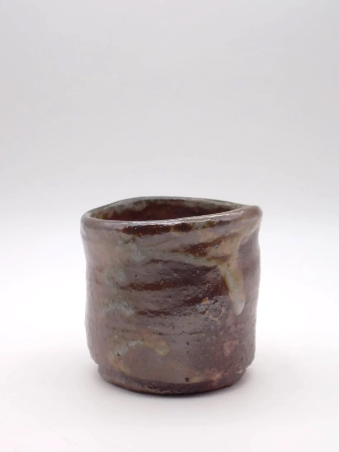 Hand thrown sake cup in grey and rusty tones by Timi Lantos Ceramics
