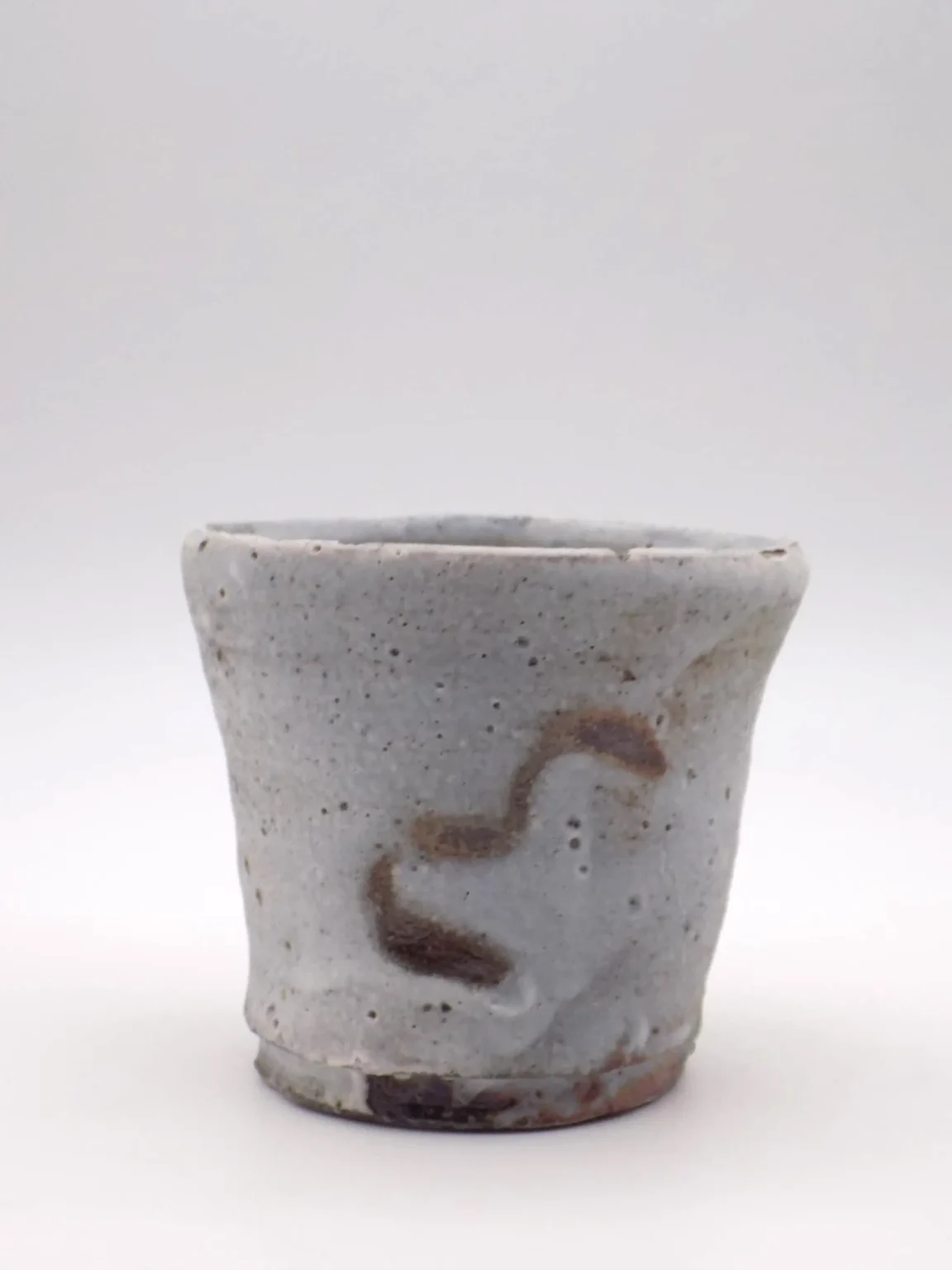 Wood fired sake cup with natural ash covered surface by Timi Lantos Ceramics