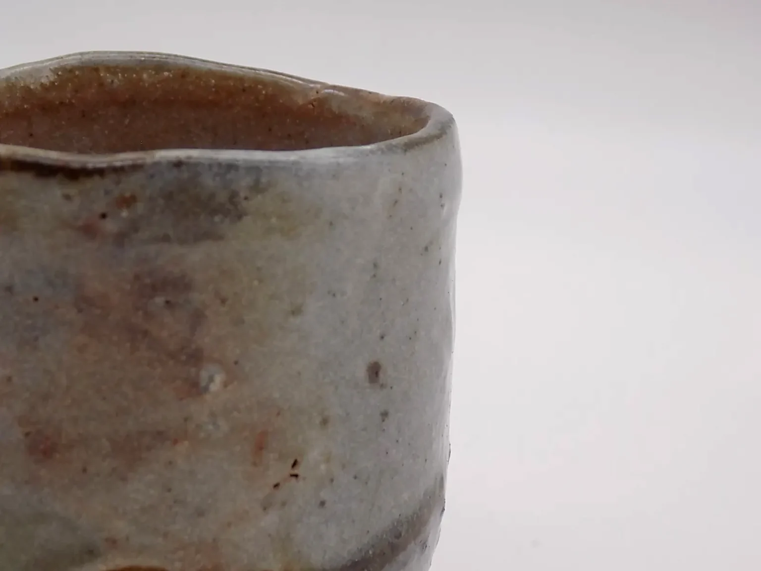 Wood Fired Sake Cup Detail in Earthy Rust Tones – Timi Lantos Ceramics