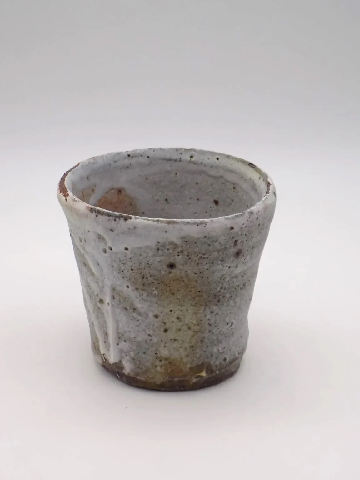 Imperfect rustic grey wood fired sake cup by Timi Lantos Ceramics