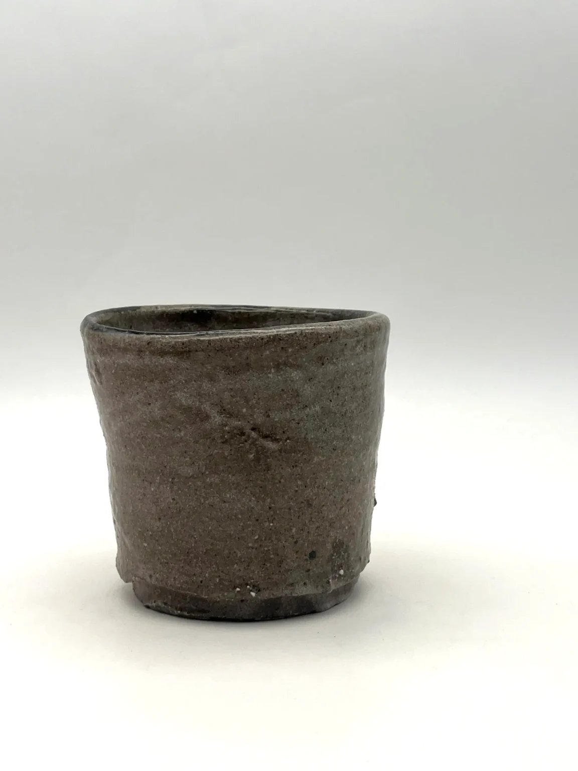 Wood fired ceramic tea cup with natural iron spots by Timi Lantos Ceramics