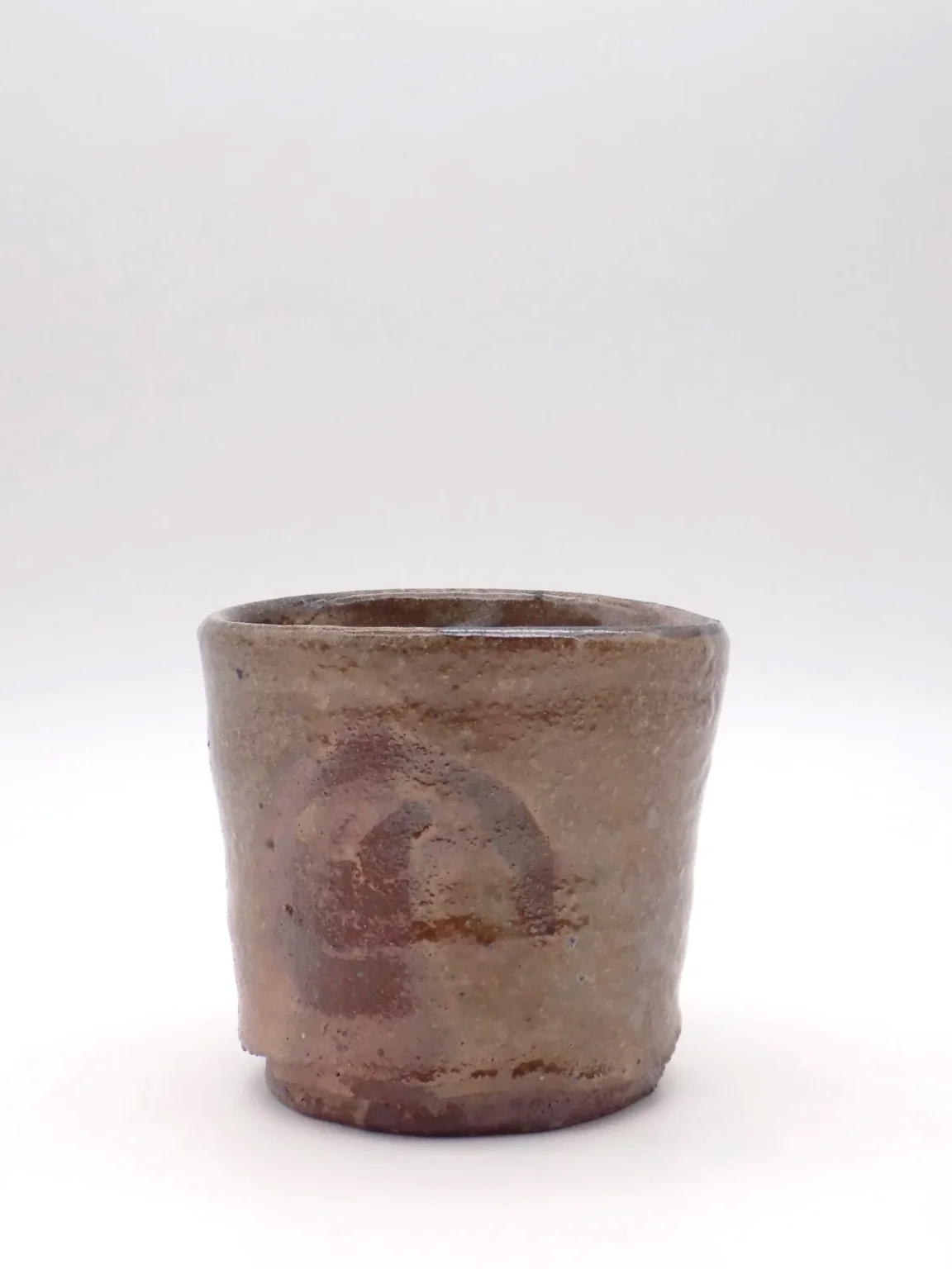 Wood fired tea cup with reduction carbon trap effect by Timi Lantos Ceramics