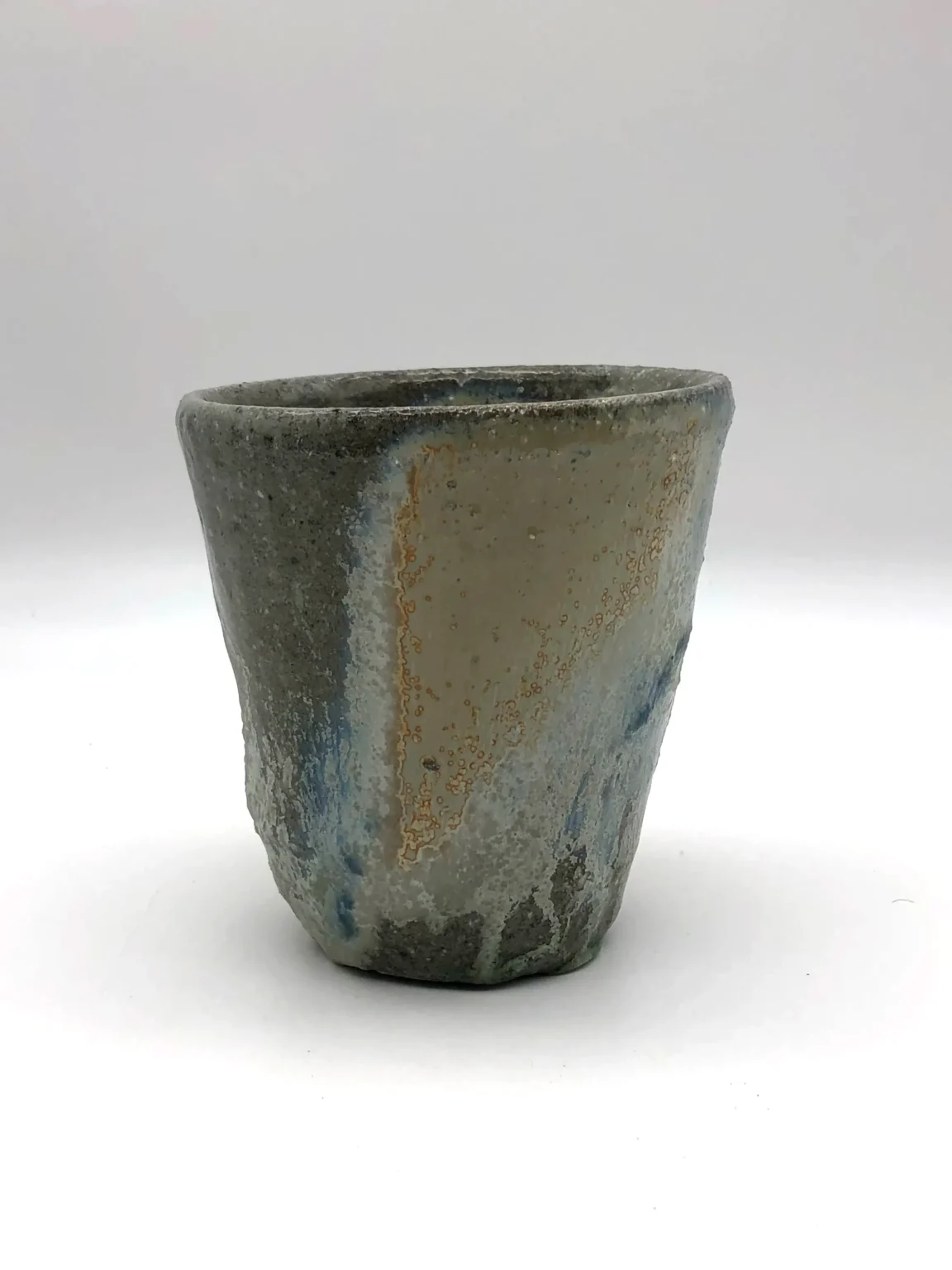 long yunomi covered with ashglaze beige color assimetry rusty timi lantos ceramics