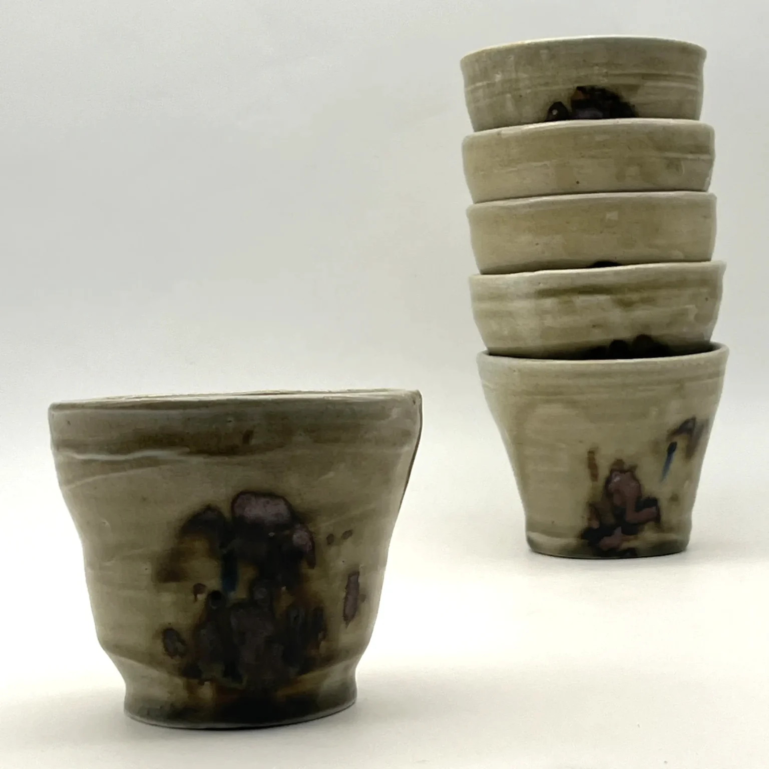 Handcrafted Japanese style yunomi tea cups in brown and grey tones by Timi Lantos Ceramics