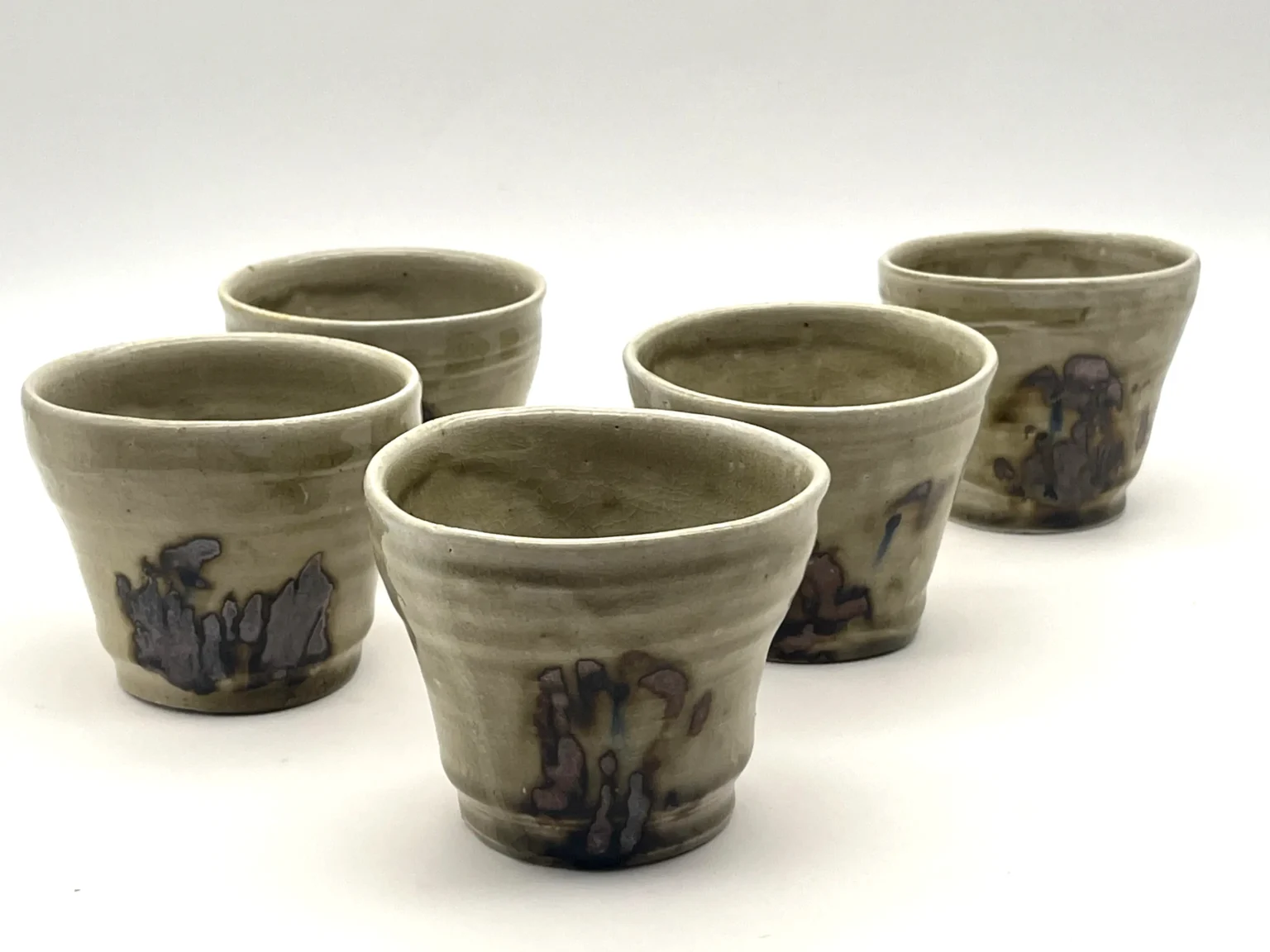 Rustic brown asymmetrical yunomi tea cups by Timi Lantos Ceramics